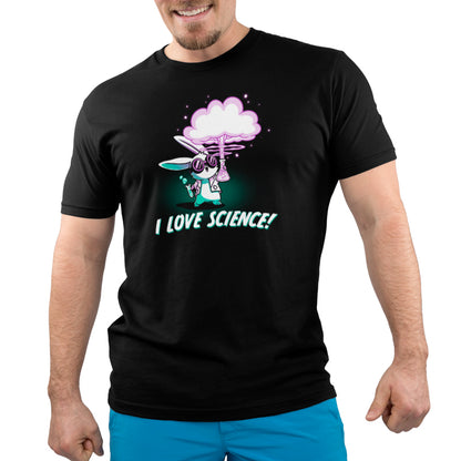 A man wearing a black t-shirt from TeeTurtle with the words "I Love Science" while experimenting with bubbling liquids.
