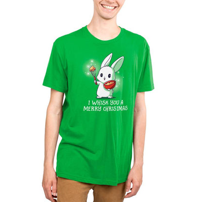 A young man wearing a green t-shirt with the words "I Whisk You A Merry Christmas" on it by TeeTurtle.