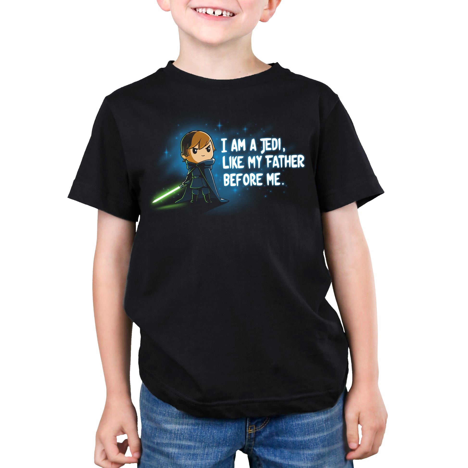A boy wearing an officially licensed Star Wars t-shirt that says "I am a Jedi like my father.