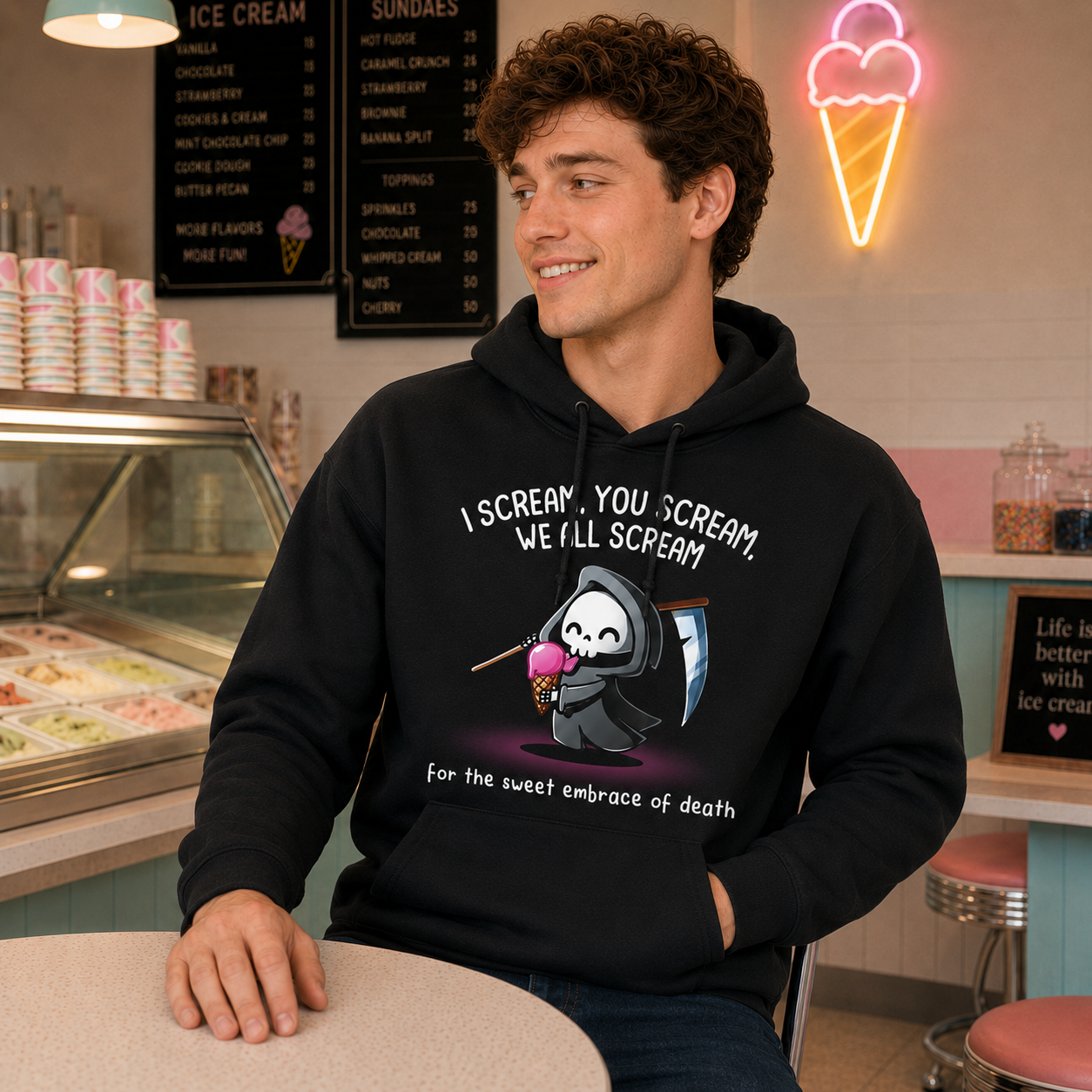 Pullover Hoodie_TeeTurtle black I Scream, You Scream Pullover Hoodie featuring a cute grim reaper holding a pink ice cream cone beside a scythe with the text "I Scream, You Scream, We All Scream" and "for the sweet embrace of death."
