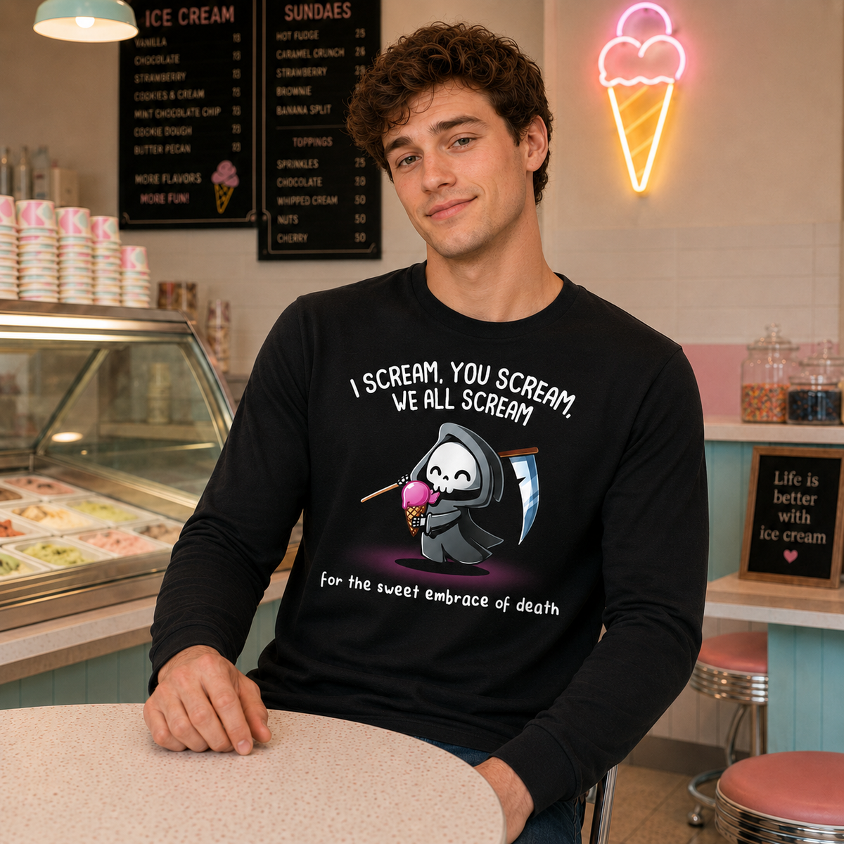 Long Sleeve T-shirt_TeeTurtle black I Scream, You Scream Long Sleeve T-shirt featuring a cute grim reaper holding a pink ice cream cone beside a scythe with the text "I Scream, You Scream, We All Scream" and "for the sweet embrace of death."