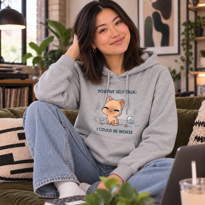 Pullover Hoodie_TeeTurtle light gray I Could Be Worse Pullover Hoodie featuring a content orange cat sitting beside a shattered vase with the text "Positive Self Talk: I Could Be Worse."