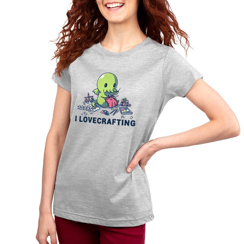 A woman wearing a silver TeeTurtle t-shirt that says I Lovecrafting.