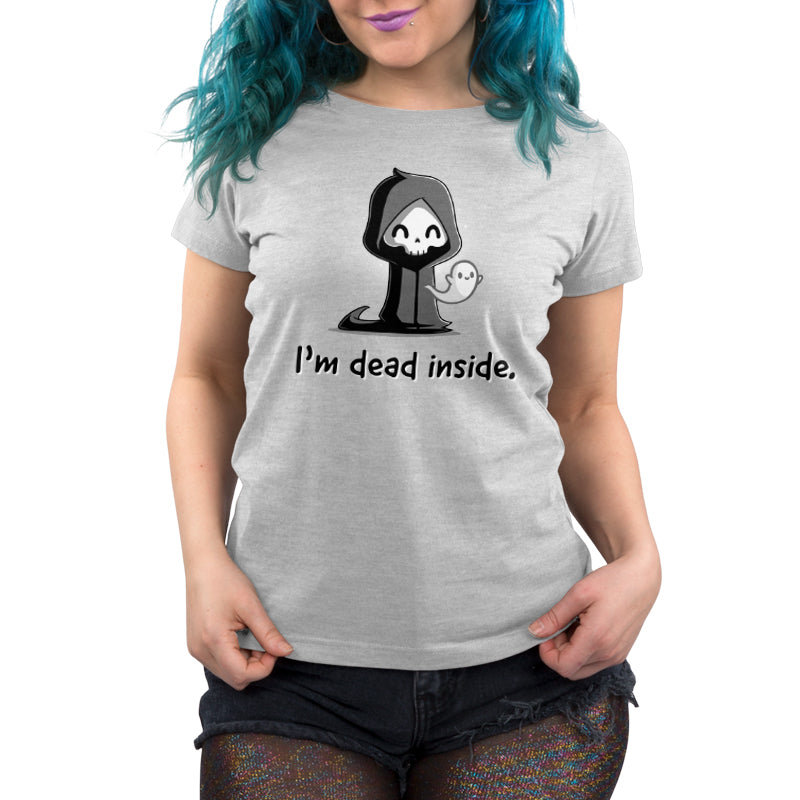 Person wearing a light gray, super soft cotton tee with a cartoon grim reaper and ghost saying "I'm Dead Inside" from monsterdigital. They have blue hair and are also wearing sparkly shorts with shredded edges.