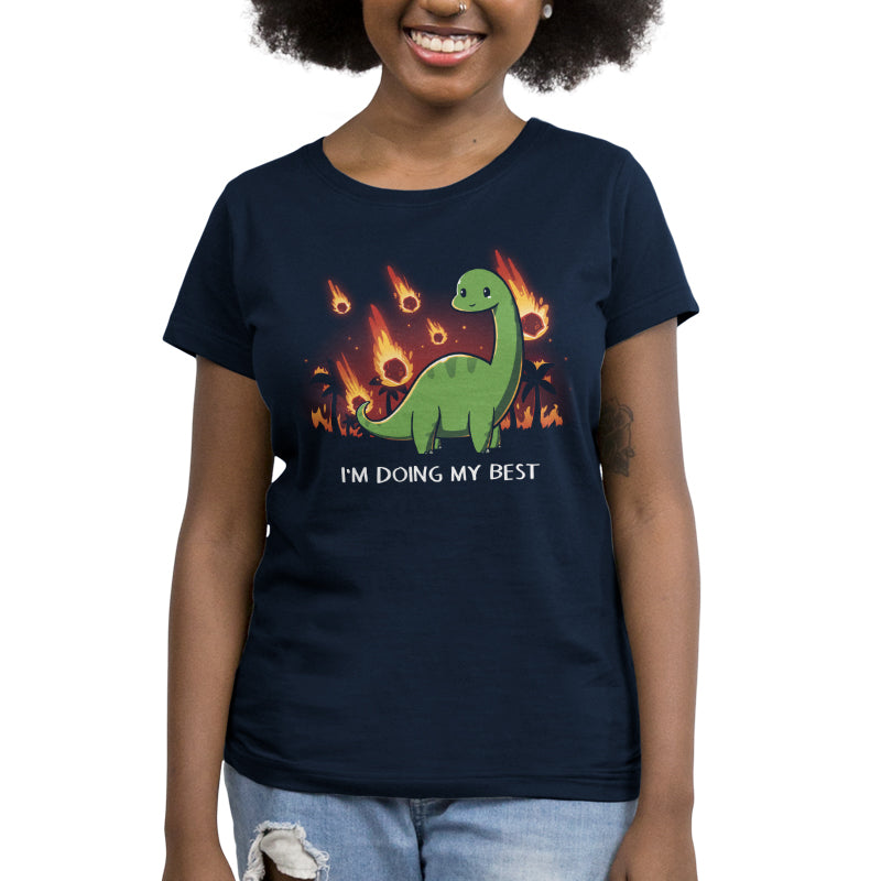 A TeeTurtle women's navy blue t-shirt with the I'm Doing My Best design featuring a dinosaur on fire.