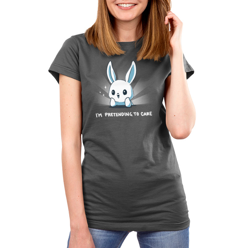 A woman wearing a TeeTurtle Silver t-shirt that says "I'm Pretending to Care.