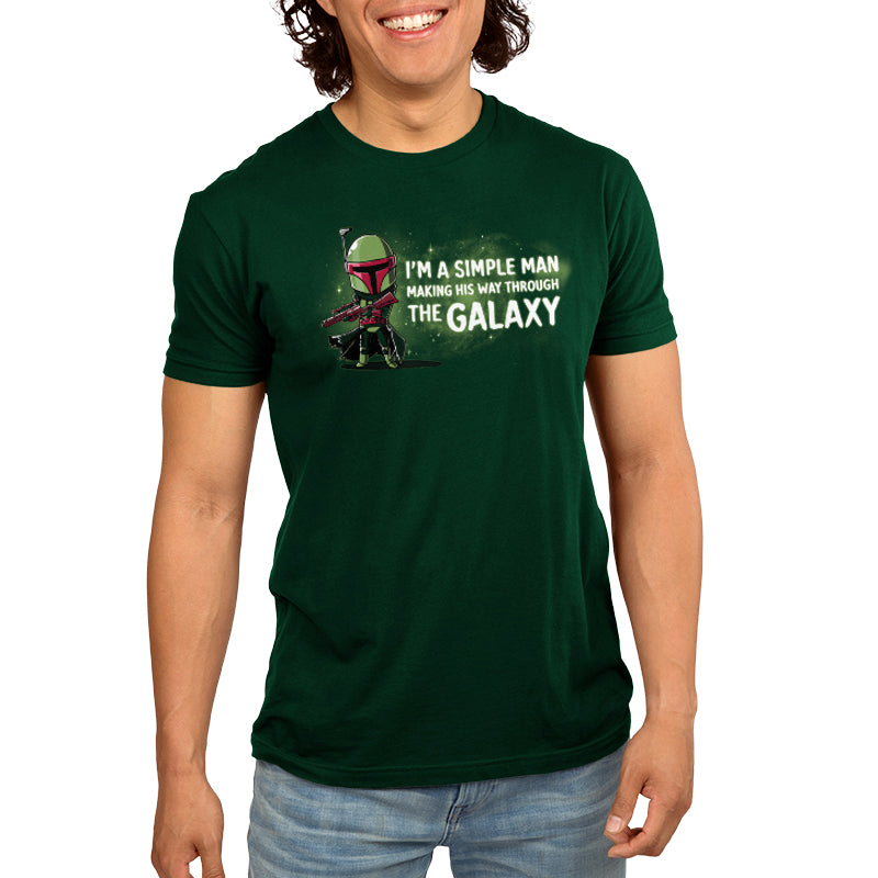 A man wearing an officially licensed Star Wars green t-shirt with the product "I'm a Simple Man (Boba Fett)"'s mantra.