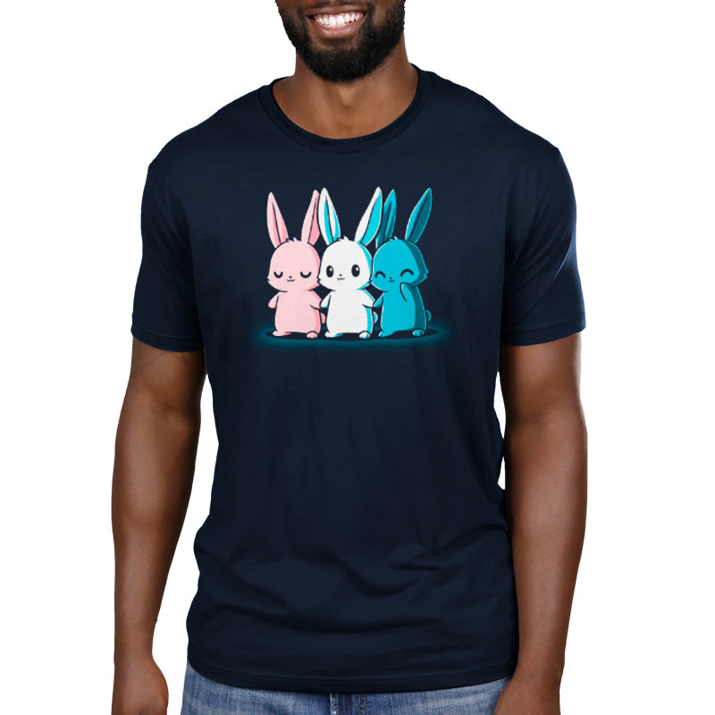 A person wearing a navy blue Inclusive Bunnies t-shirt by monsterdigital made from super soft ringspun cotton, featuring a graphic of three cute bunnies in pink, white, and blue.