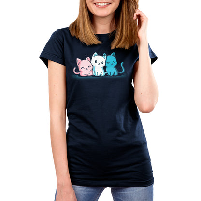 A woman wearing a navy blue women's t - shirt with three cats on it from TeeTurtle's Inclusive Kitties collection.