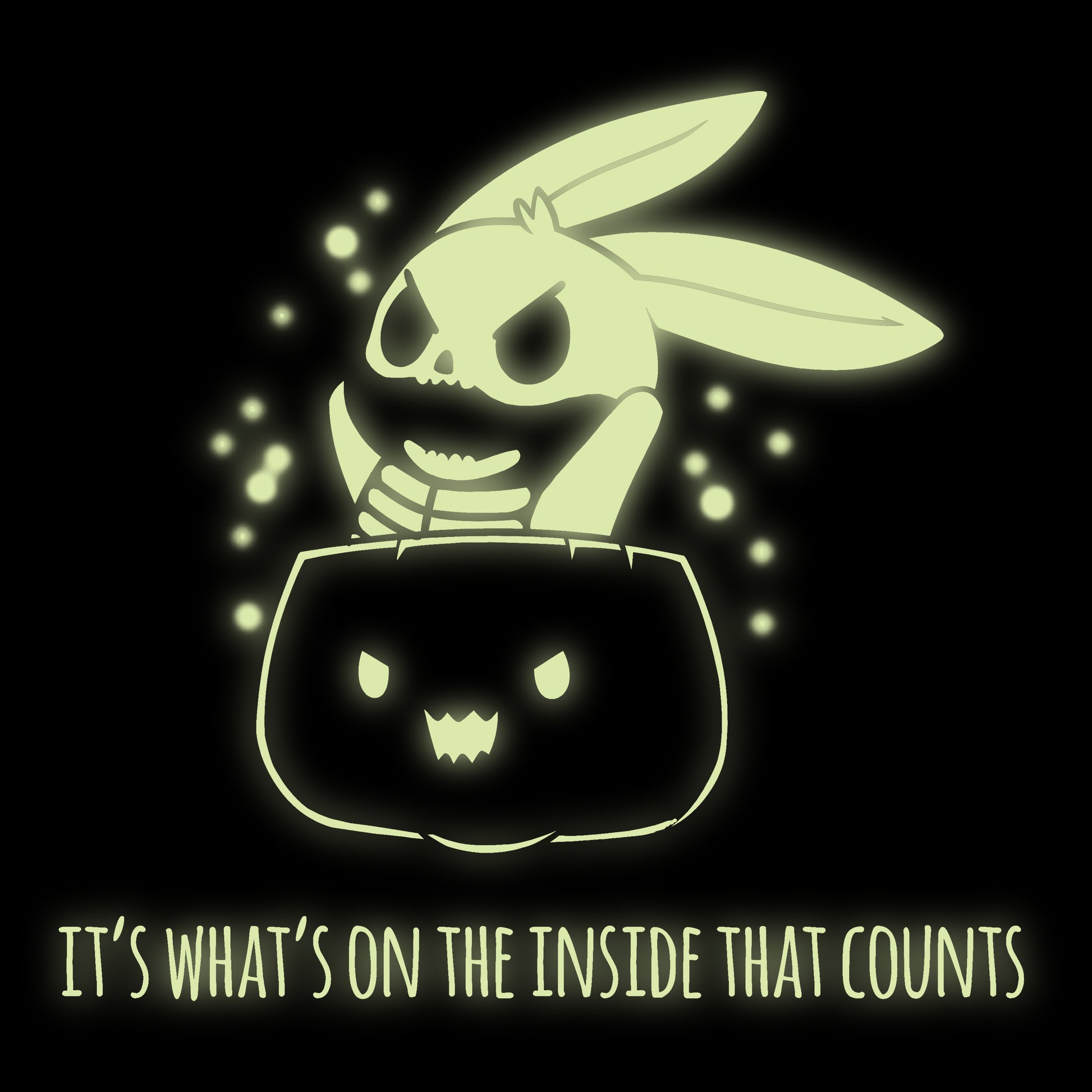 A cute and spooky What's on the Inside (Glow) black t-shirt by TeeTurtle that glows from the inside.