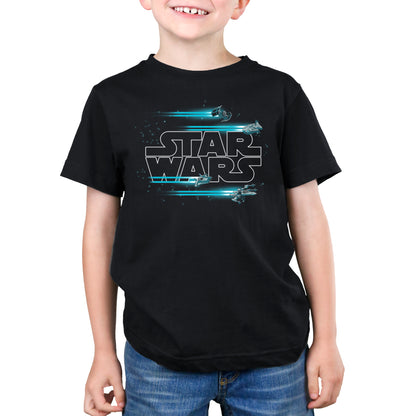 A young boy wearing a Jump to Hyperspace T-shirt by Star Wars.