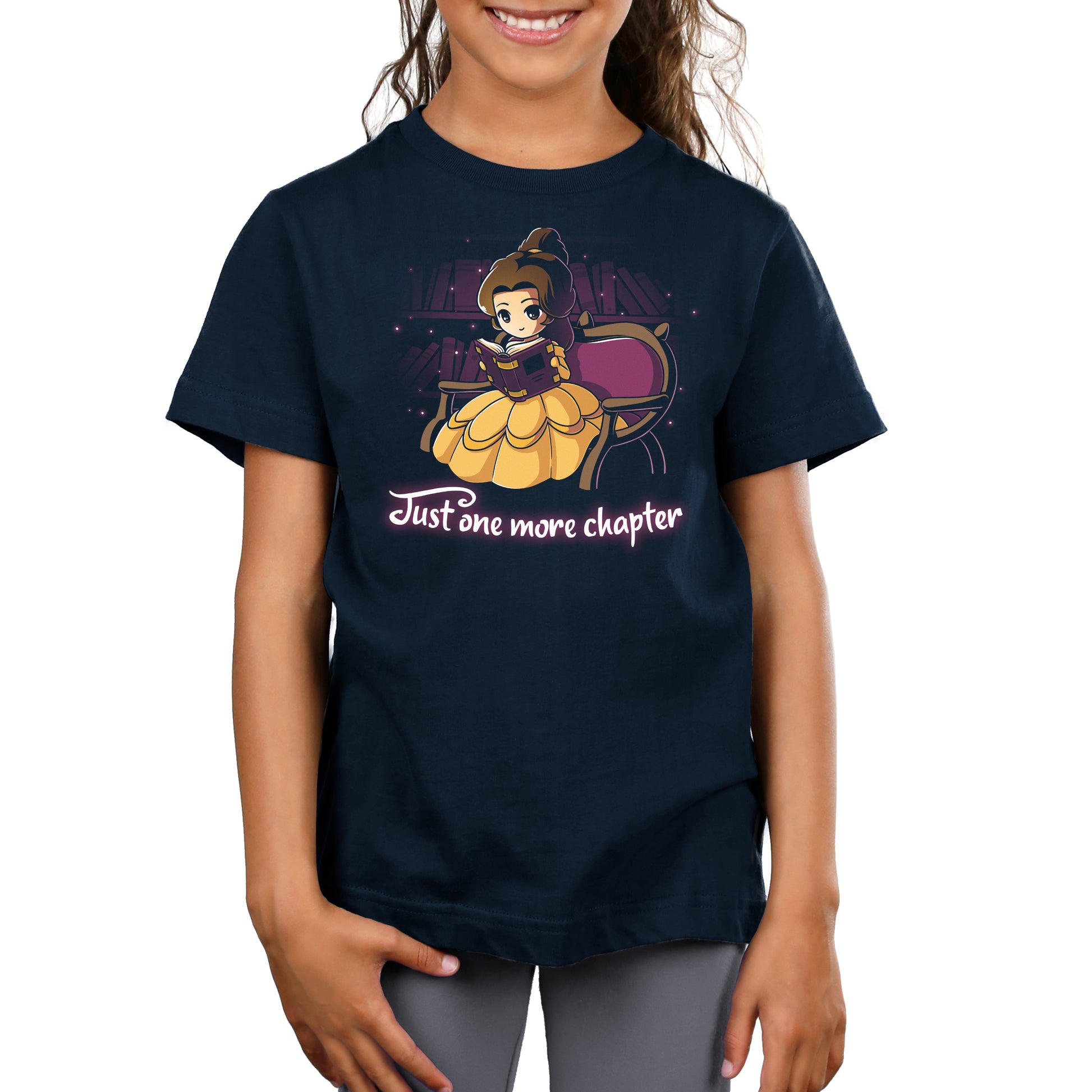 A Disney Belle-inspired girl smiling at the camera, wearing "Just One More Chapter" apparel.