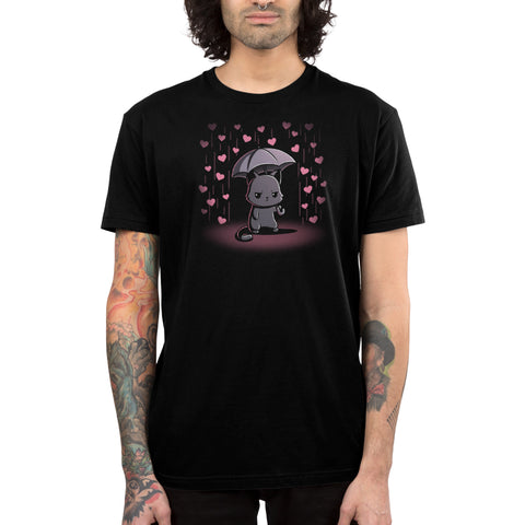 Premium Cotton T-shirt_TeeTurtle black Feeling Forecast Nope Premium Cotton T-shirt featuring a cat frowning and holding an umbrella, in the background there is pink rain with hearts.