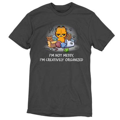 Premium Cotton T-shirt_TeeTurtle charcoal gray I'm Not Messy, I'm Creatively Organized apparel featuring a smug Garfield surrounded by a messy assortment of objects.