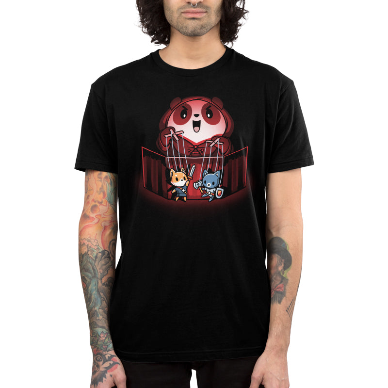 Premium Cotton T-shirt_TeeTurtle Puppet Master black t-shirt featuring an illustration of a cartoon panda smiling evilly and standing behind a puppet  theater holding a fox puppet with a sword in the left hand and a cat with an axe and shield in the right hand. The illustration is being illuminated by a red glow.