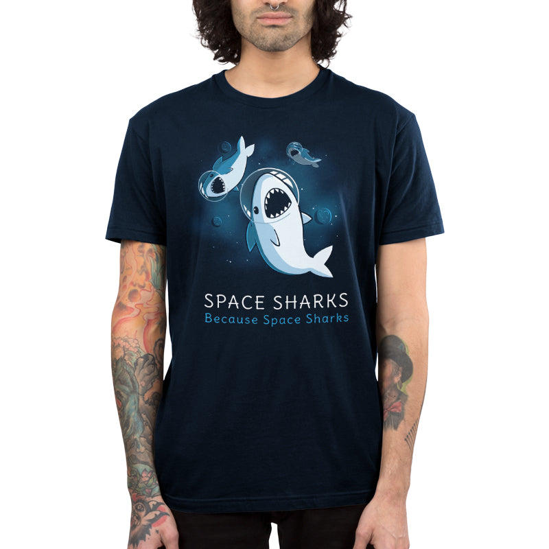 Premium Cotton T-shirt_TeeTurtle Space Sharks navy blue t-shirt featuring an illustration of three sharks with their mouths open showing teeth wearing air helmets floating in space with blue moons and stars in the background. The words "SPACE SHARKS Because Space sharks" are written underneath.