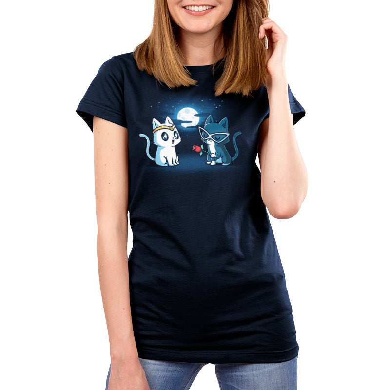 Premium Cotton T-shirt_TeeTurtle Star-Crossed Lovers navy blue t-shirt featuring a white cat with large, black starry eyes wearing a gold headband and a gray cat wearing white glasses looking smitten holding a red rose. The background features a full moon surrounded by clouds and stars. 