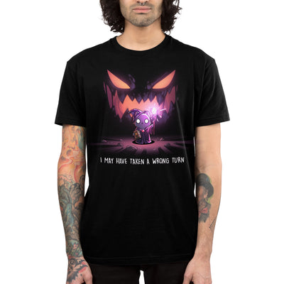 Premium Cotton T-shirt_TeeTurtle black Wrong Turn apparel featuring an anxious cat wizard in a dark cave holding up a staff providing light with silhouette that looks like a sinister monster smiling in the background with the caption, “I May Have Taken a Wrong Turn“.