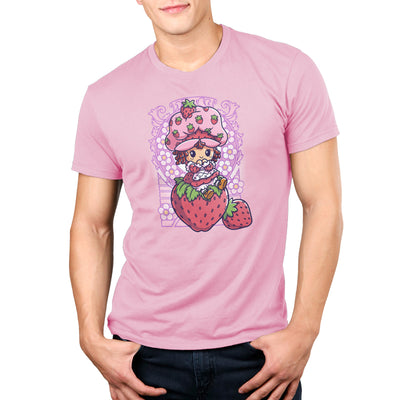 Premium Cotton T-shirt_TeeTurtle light pink Vintage Strawberry Shortcake apparel featuring Strawberry Shortcake sitting on a strawberry with art nouveau illustration elements.