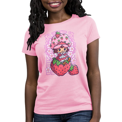 Premium Cotton T-shirt_TeeTurtle light pink Vintage Strawberry Shortcake apparel featuring Strawberry Shortcake sitting on a strawberry with art nouveau illustration elements.