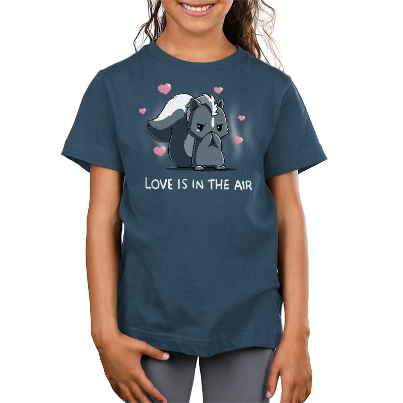 Premium Cotton T-Shirt_TeeTurtle denim blue Scentimental Feelings Premium Cotton T-Shirt featuring a skunk standing up on its back legs with its front paws covering its nose, hearts coming out in the background with the caption, "love is in the air".