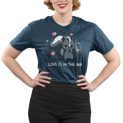 Premium Cotton T-Shirt_TeeTurtle denim blue Scentimental Feelings Premium Cotton T-Shirt featuring a skunk standing up on its back legs with its front paws covering its nose, hearts coming out in the background with the caption, "love is in the air".