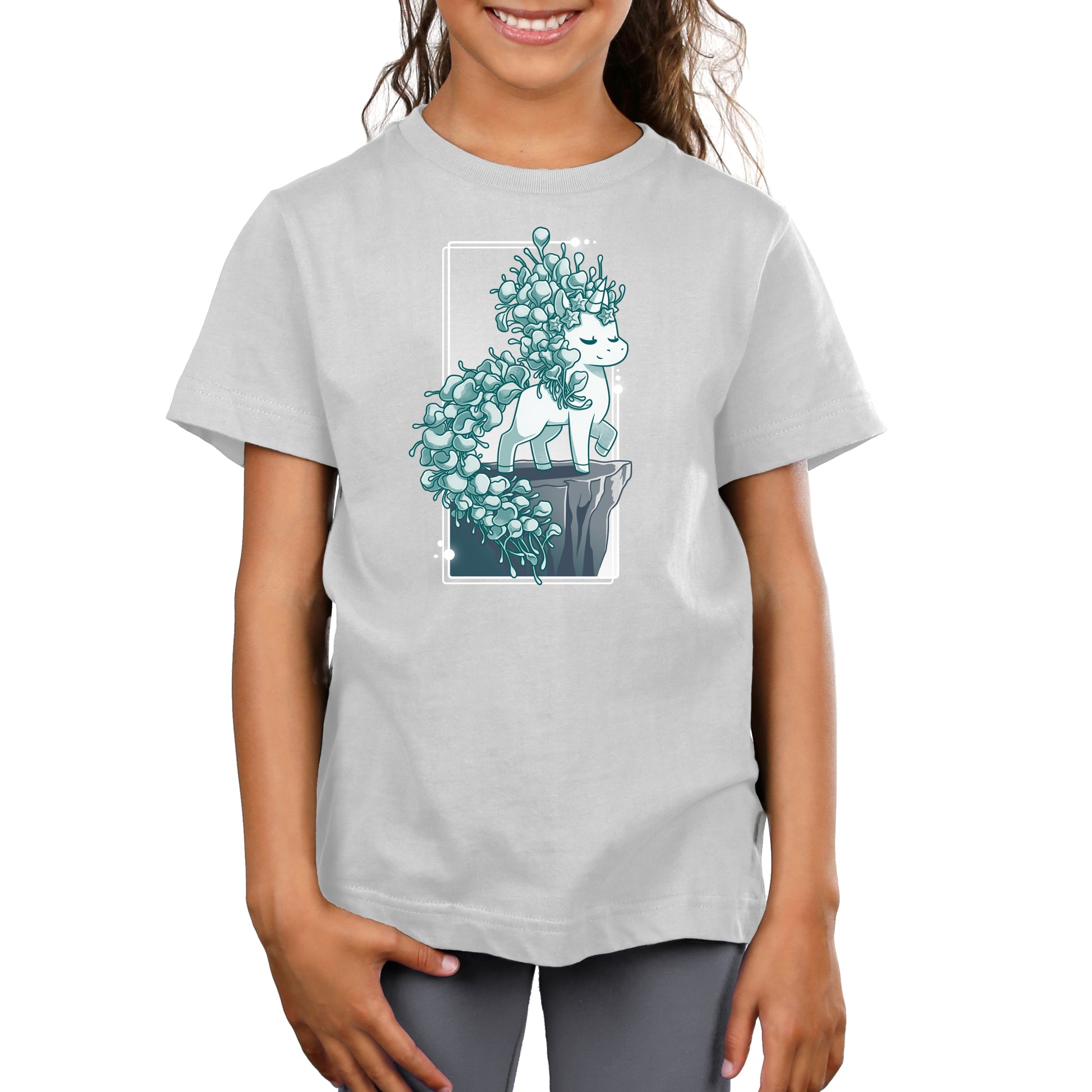 Premium Cotton T-shirt_TeeTurtle silver gray Botanicorn apparel featuring a magical unicorn with a mane and tail made out of the plant silver falls, or silver nickel vine, standing elegantly with a hoof raised on a cliff.
