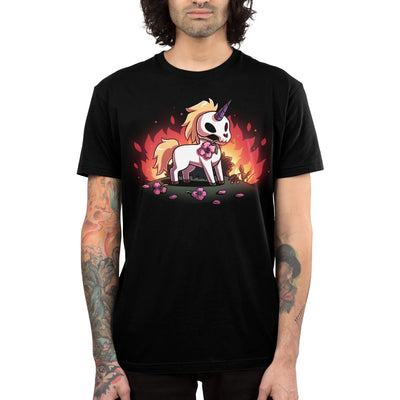 Premium Cotton T-shirt_TeeTurtle black Chaotic Good apparel featuring a skull unicorn holding a pink flower in its mouth with dead flowers at its feet and fire in the background.