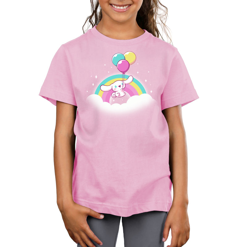 Premium Cotton T-shirt_TeeTurtle light pink Cinnamoroll Takes Flight apparel featuring Cinnamoroll floating in the clouds with a teal, yellow, and pink rainbow in the background, and holding onto balloons in the same colors as the rainbow.