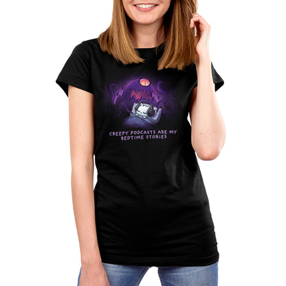 Premium Cotton T-shirt_TeeTurtle black Creepy Podcasts Are My Bedtime Stories apparel featuring a cat lying down in bed cozily wearing headphones with a giant purple monster looming over it and waving its tentacles.