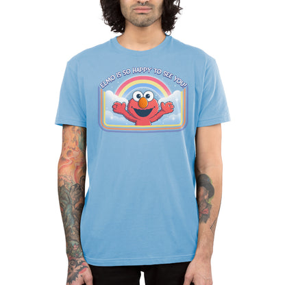 Premium Cotton T-shirt_TeeTurtle light blue Elmo Is So Happy To See You Premium Cotton T-shirt featuring Elmo from Sesame Street. He's smiling and has his arms wide as if he's going in for a hug. There's a rainbow and clouds behind him and  there is a retro style border along the sides and bottom. At the top is the text "Elmo Is So Happy To See You." 