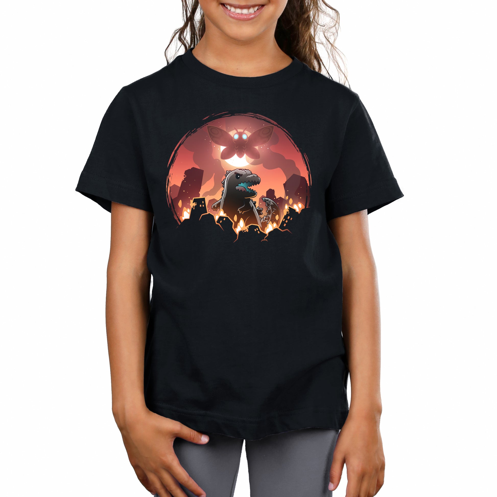 Premium Cotton T-shirt_TeeTurtle black Godzilla and Mothra Rampage apparel featuring Godzilla rampaging around a burning city with Mothra floating in the sky in front of a full moon.