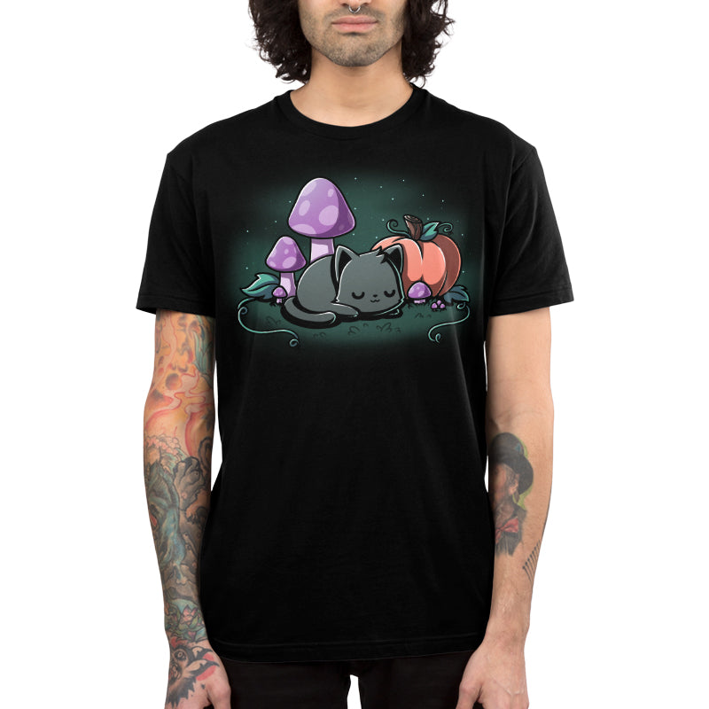 Premium Cotton T-shirt_TeeTurtle black Harvest Haze apparel featuring a black cat sleeping among a pumpkin and purple mushrooms.