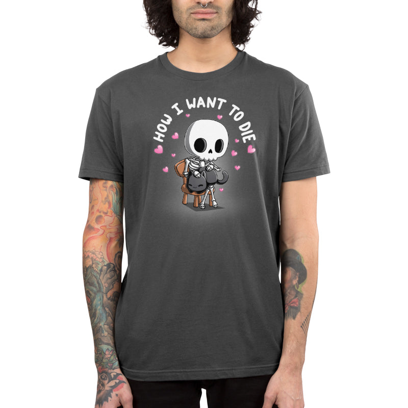 Premium Cotton T-shirt_TeeTurtle charcoal gray How I Want To Die apparel featuring a skeleton sitting on a chair petting a black cat surrounded by pink hearts with the caption, "How I Want To Die".