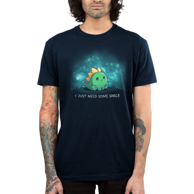 Premium Cotton T-shirt_TeeTurtle navy blue I Just Need Some Space apparel featuring a stegosaurus sitting on top of a hill alone with constellations in the background.