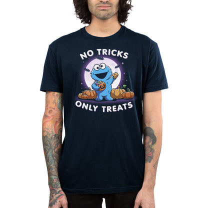 Premium Cotton T-shirt_TeeTurtle navy blue No Tricks Only Treats (Cookie Monster) apparel featuring Cookie Monster holding a cookie and a pumpkin basket of treats with pumpkins, bats, and a full moon in the background, and the caption, “No Tricks, Only Treats“.