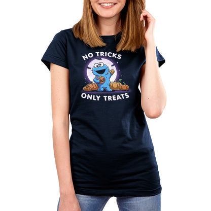 Premium Cotton T-shirt_TeeTurtle navy blue No Tricks Only Treats (Cookie Monster) apparel featuring Cookie Monster holding a cookie and a pumpkin basket of treats with pumpkins, bats, and a full moon in the background, and the caption, “No Tricks, Only Treats“.