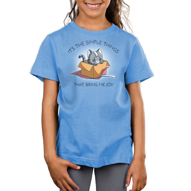 Premium Cotton T-shirt_TeeTurtle light blue Purr Box of Joy apparel featuring a gray cat in an unwrapped box with wrapping paper and ribbons, and the caption, “It’s the Simple Things That Bring Me Joy“.