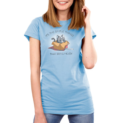 Premium Cotton T-shirt_TeeTurtle light blue Purr Box of Joy apparel featuring a gray cat in an unwrapped box with wrapping paper and ribbons, and the caption, “It’s the Simple Things That Bring Me Joy“.
