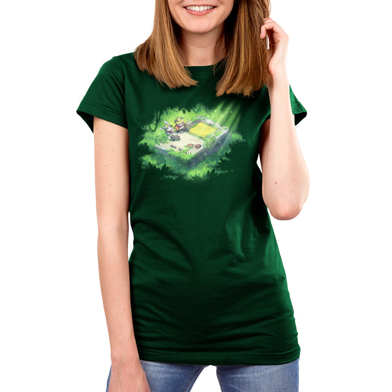 Premium Cotton T-shirt_TeeTurtle forest green Relics of the Past apparel featuring a panda and a bunny wearing explorer outfits climbing over a gigantic handheld video gaming device that’s overgrown with plants in a jungle.