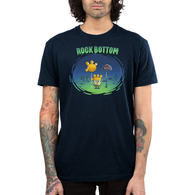 Premium Cotton T-shirt_TeeTurtle navy blue SpongeBob Rock Bottom apparel featuring SpongeBob Square Pants holding a yellow balloon that looks like a four fingered hand while wearing a second simliar balooon on his head as a hat. He looks sad and he's next to a "Buz" sign.The words "Rock Bottom" are on top in green and they look like they are melting or dripping. 