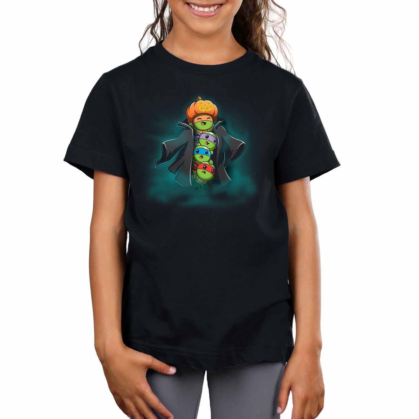 Premium Cotton T-shirt_TeeTurtle black TMNT Stack-o'-Lantern apparel featuring Michelangelo, Donatello, Leonardo, and Raphael in a stack wearing a trench coat with Michelangelo holding a pumpkin as their costume’s head, and with a spooky foggy background.