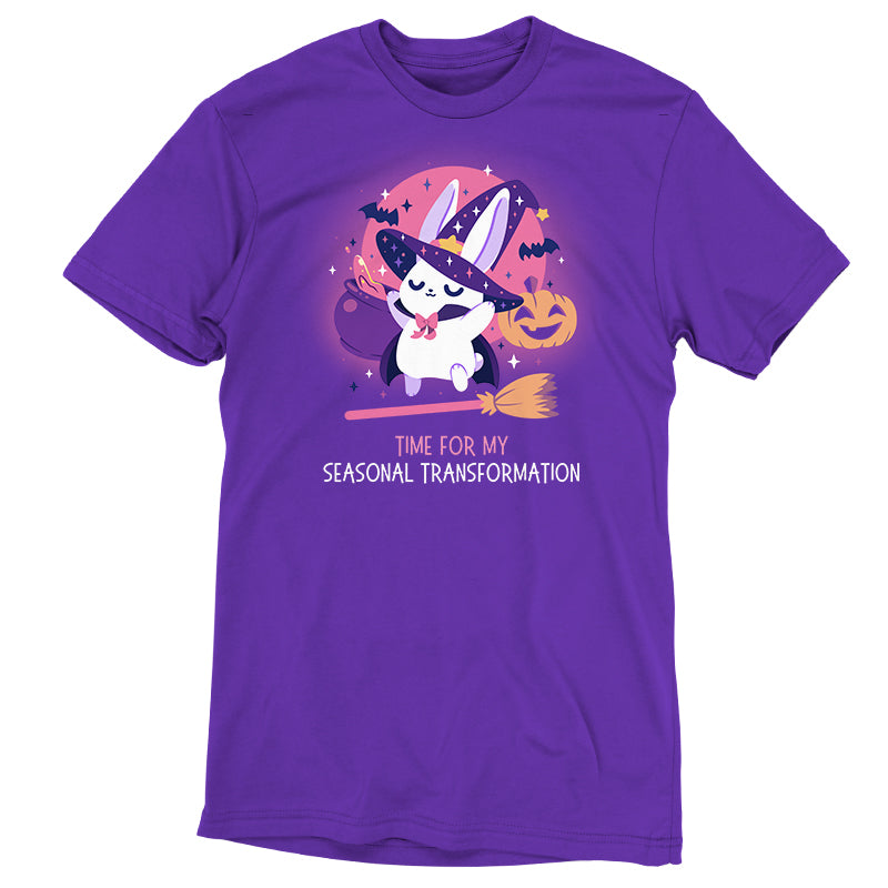 Premium Cotton T-shirt_TeeTurtle purple Time For My Seasonal Transformation apparel featuring a white bunny wearing a sparkling purple witch hat and cloak on top of a flying broom with a cauldron, bats, jack-o'-lantern, and the full red moon in the background.