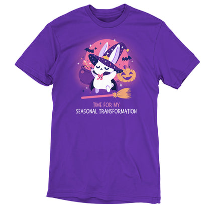 Premium Cotton T-shirt_TeeTurtle purple Time For My Seasonal Transformation apparel featuring a white bunny wearing a sparkling purple witch hat and cloak on top of a flying broom with a cauldron, bats, jack-o'-lantern, and the full red moon in the background.