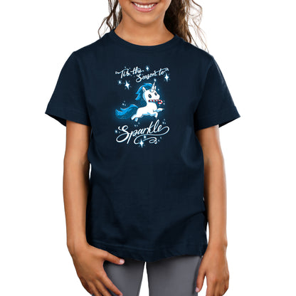 Premium Cotton T-shirt_TeeTurtle navy blue 'Tis The Season To Sparkle apparel featuring a leaping unicorn with a candy cane in its mouth surrounded by sparkles, with the caption, “'Tis The Season To Sparkle“.