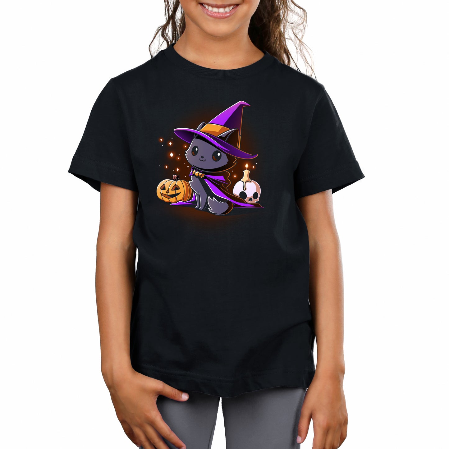 Premium Cotton T-shirt_TeeTurtle black Witch, I’m Purrfect apparel featuring a black cat wearing a purple witch hat and cloak surrounded by sparkles, a jack-o'-lantern, and a skull with a lit candle on top.