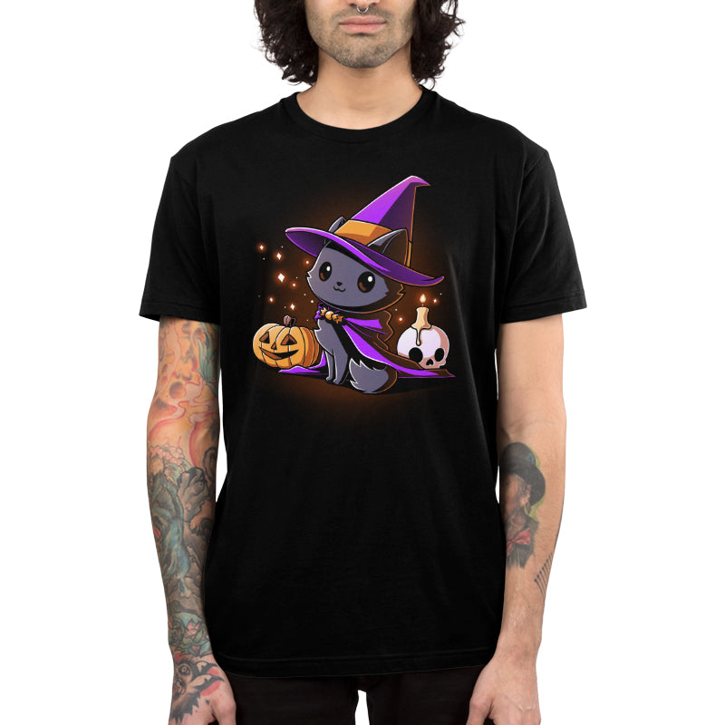 Premium Cotton T-shirt_TeeTurtle black Witch, I’m Purrfect apparel featuring a black cat wearing a purple witch hat and cloak surrounded by sparkles, a jack-o'-lantern, and a skull with a lit candle on top.