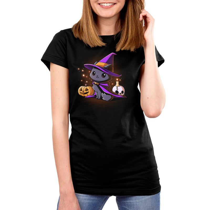 Premium Cotton T-shirt_TeeTurtle black Witch, I’m Purrfect apparel featuring a black cat wearing a purple witch hat and cloak surrounded by sparkles, a jack-o'-lantern, and a skull with a lit candle on top.
