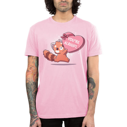 Premium Cotton T-shirt_TeeTurtle light pink You're Alright. apparel featuring a red panda holding a giant heart-shaped box of chocolates labeled, "You're Alright."