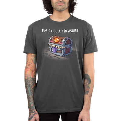 Premium Cotton T-shirt_TeeTurtle charcoal gray I'm Still a Treasure apparel featuring a mimic happily smiling with its tongue out.